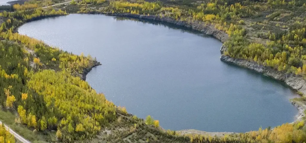 This image has an empty alt attribute; its file name is Cluff-Lake-Uranium-Mine-Reclaimed-e1761689954710-1024x479.webp